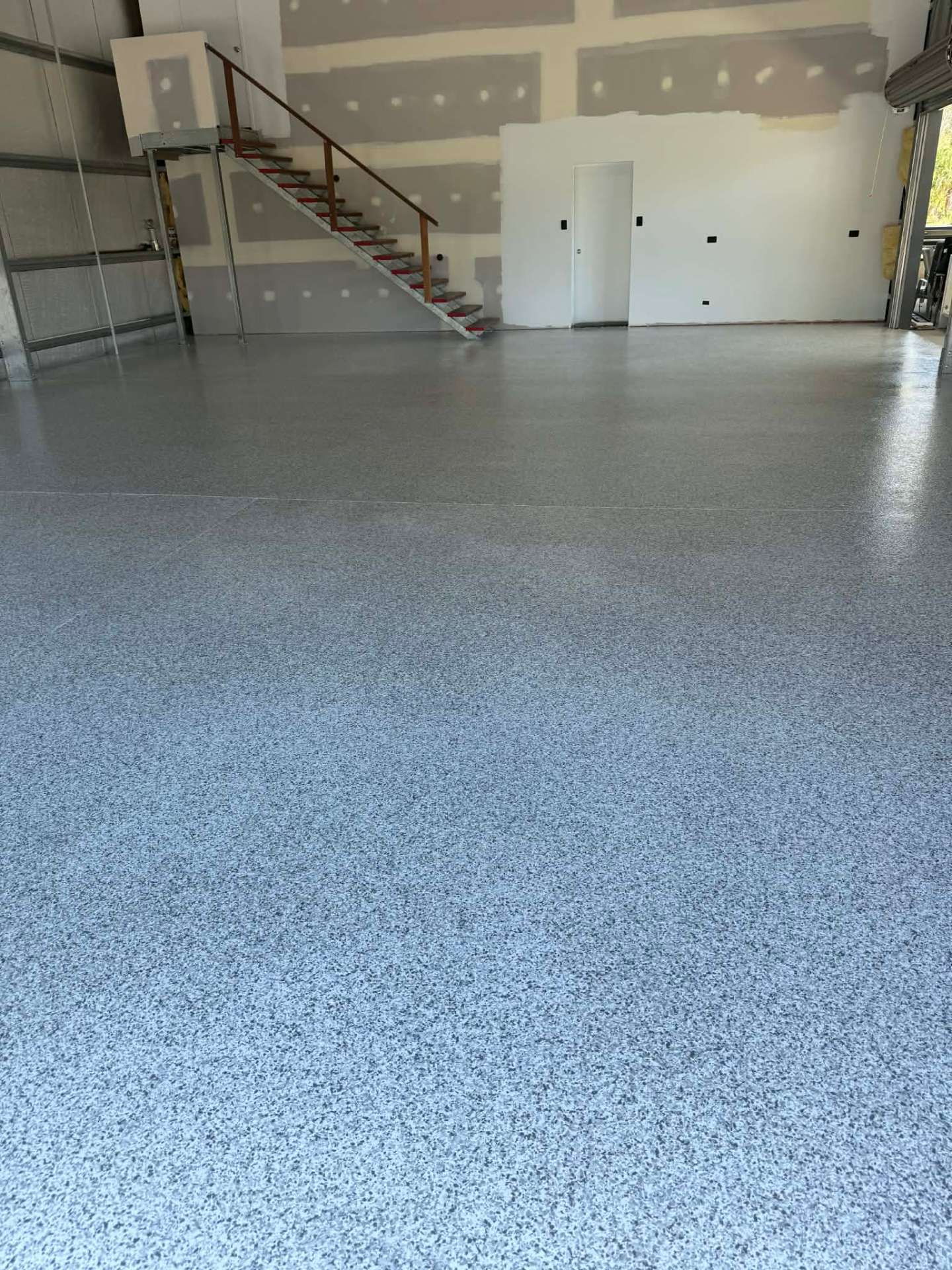 Workshop interior with hard-wearing flake epoxy floor