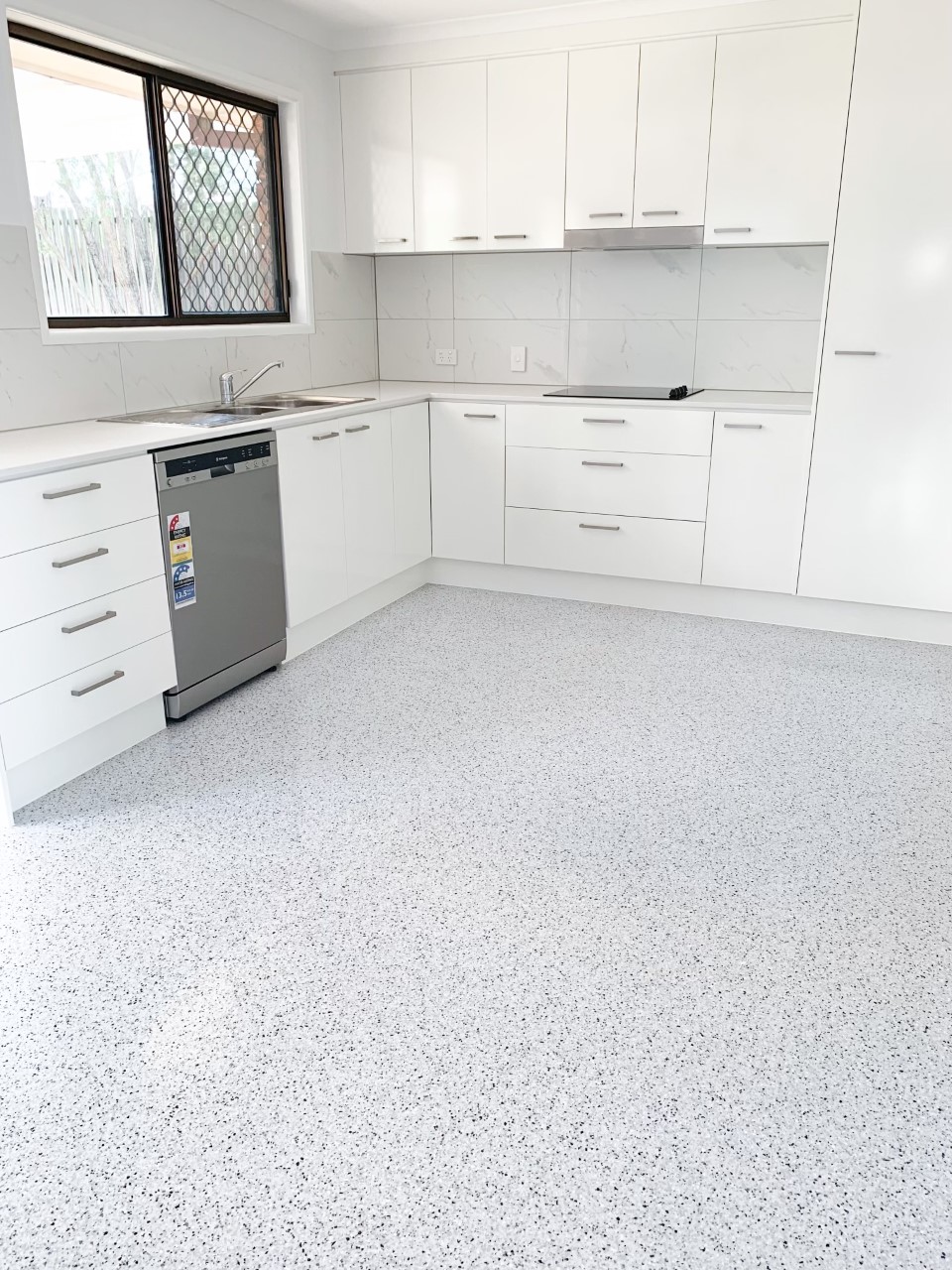 Modern kitchen with white ultra-flake epoxy floor