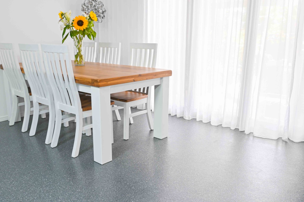 Dining room with dark grey basalt flake epoxy