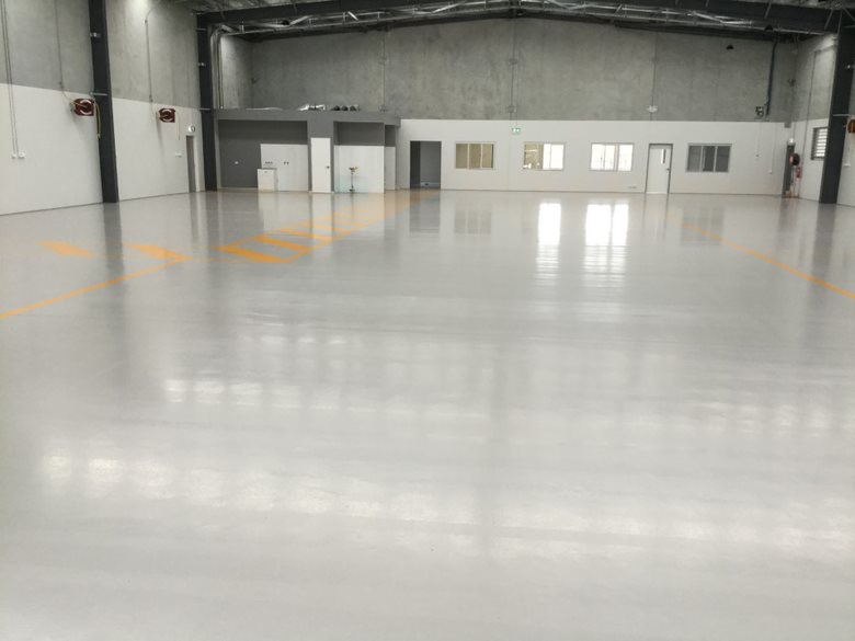 Commercial warehouse with light grey epoxy and line marking