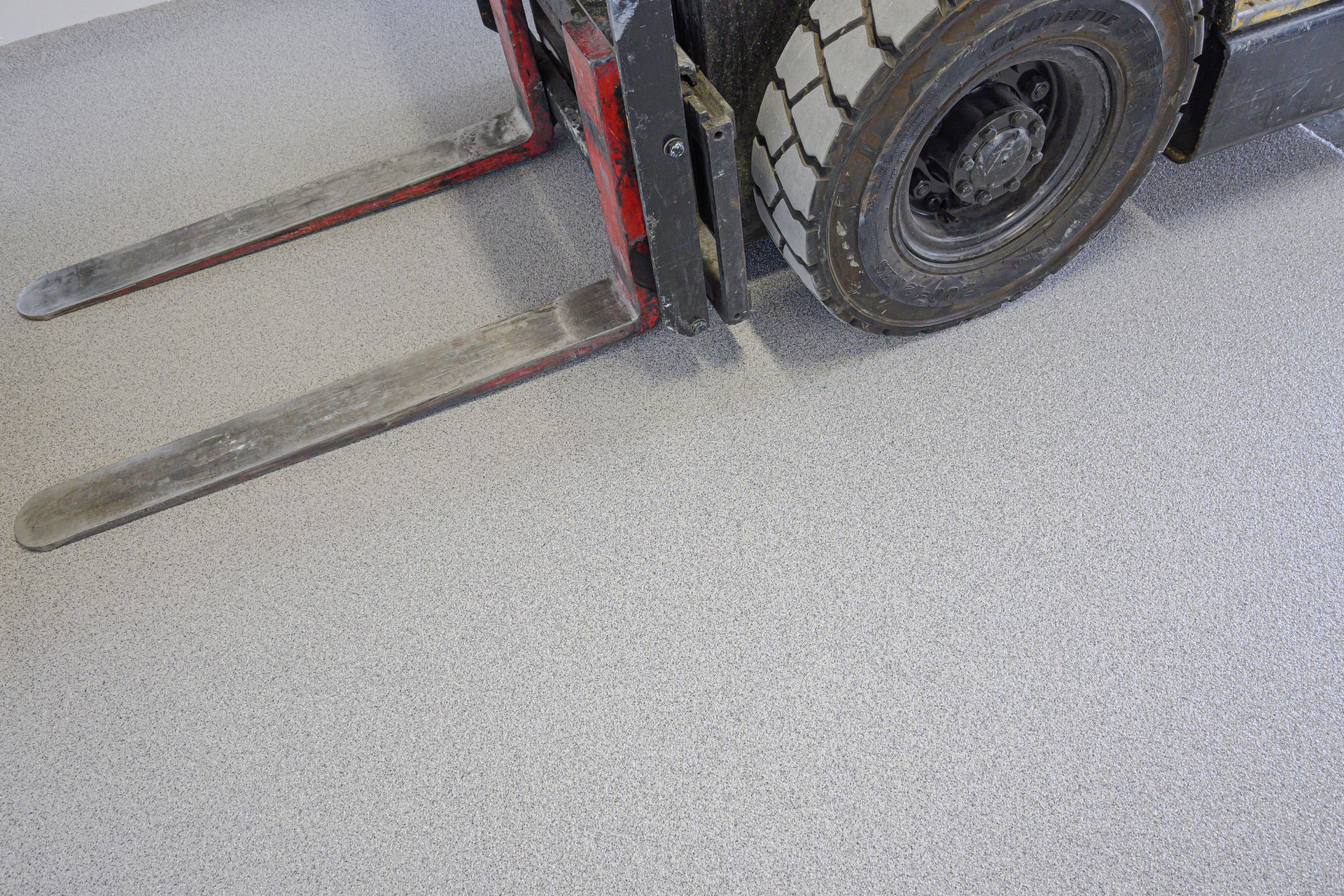 Forklift on heavy-duty silver flake industrial epoxy